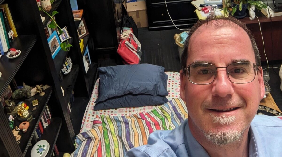 Professor Ron Hassner shows the bed he set up in his office to protest antisemitism at the University of California, Berkeley, in March 2024.