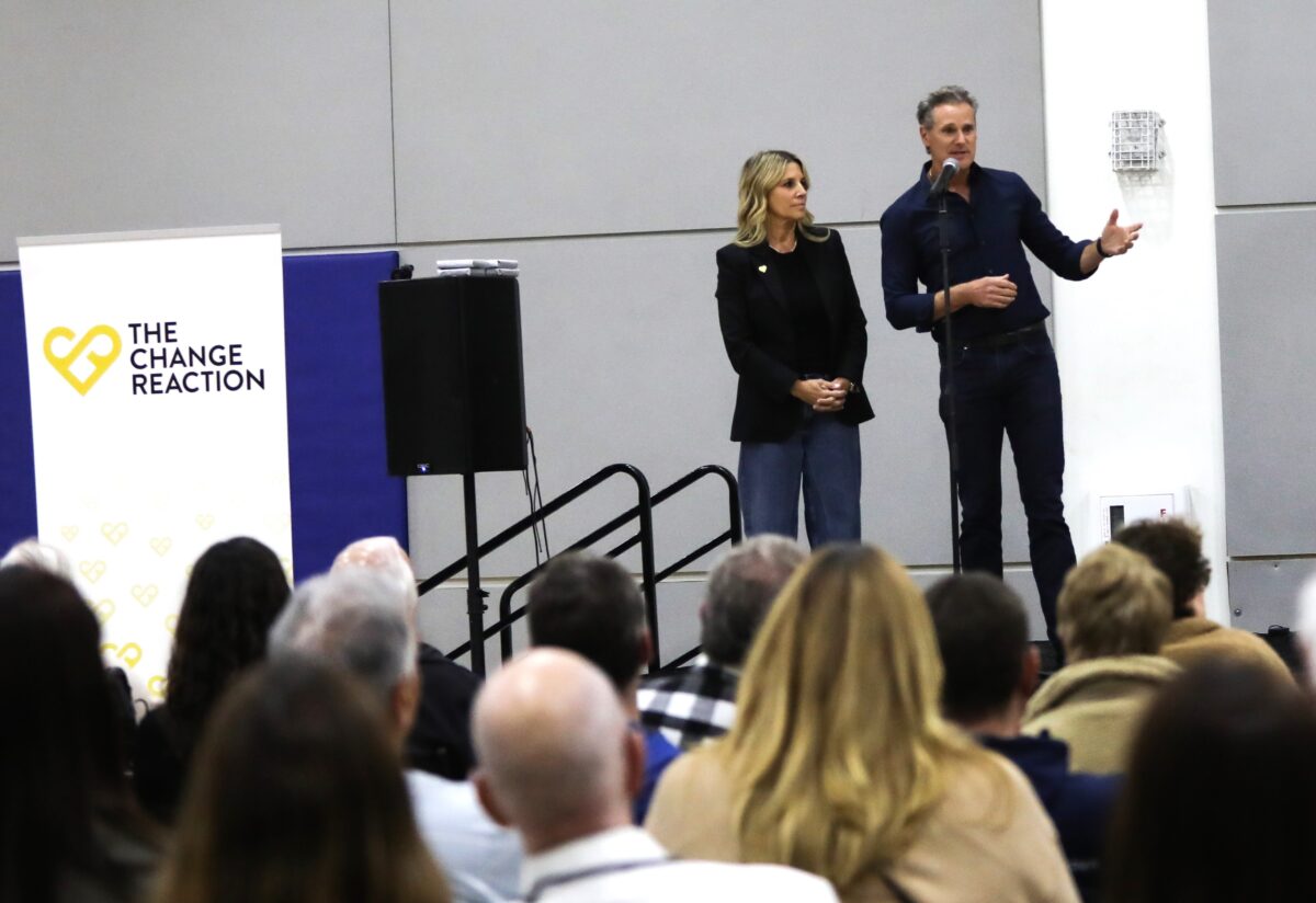 Greg and Jodi Perlman speak at an event held by their foundation, The Change Reaction, in which checks were given to people affected by the Los Angeles wildfires in the city's Altadena neighborhood in January 2025.
