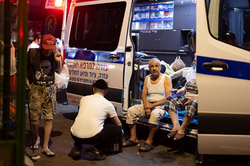 Israeli medics treat people wounded in Iran's missile attack in the city of Bat Yam, a suburb of Tel Aviv, on June 15, 2025.