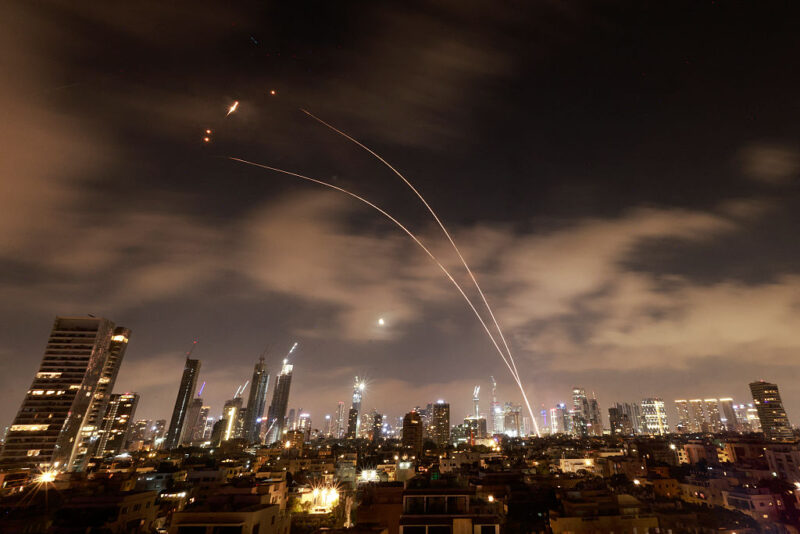 Israeli air defence systems are activated to intercept Iranian missiles over the Israeli city of Tel Aviv early on June 18, 2025.